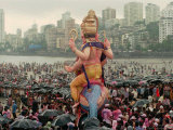 A Crowd of Revellers Carry a Statue of Ganesh Photographic Print