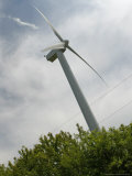 The Portsmouth Abbey Windmill Hovers Above the Treeline and Generates Power Photographic Print by Stew Milne