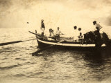 Fisherman Embarking from the Seashore on Their Boat Photographic Print
