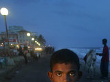 A Sri Lankan Boy Looks as He Sells Prawns at the Sea Front, in Colombo, Sri Lanka, June 30, 2006 Photographic Print by Manish Swarup