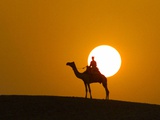 An Egyptian Policeman Looks at the Setting Sun Photographic Print