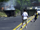 Two Children Take Advantage of a Blockade Photographic Print