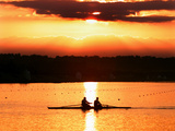 A Beautiful Sunrise Over the Sydney International Regatta Center Sillouhettes a Boat Photographic Print