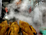 A Young Boy Sells Chicken Broth at a Stall Photographic Print