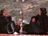 Two Unidentified Iranian Women Smoke a Water Pipe Photographie
