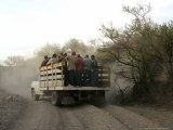 A Group of Men Look on as Their Truck is Stuck in Dirt Tracks Photographic Print