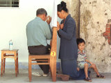 A Vietnamese Woman Sits with a Priest at a Makeshift Confessional Along Side of the La Vang Church Photographic Print