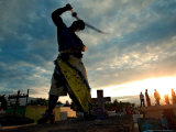 Dominican People Disguised as Cachuas Fight with Whips Over the Tombs Lámina fotográfica
