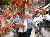 Vietnamese Vendors Crowd a Street Selling Colored Lanterns on a Street in Downtown Hanoi Photographic Print