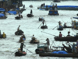 Vietnamese Fishermen and Daily Commuters Make Their Way Along the Ganh Hao River Photographic Print