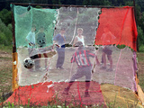 A Soccer Ball Slips Through an Opening of a Makeshift Goal Fotografie-Druck