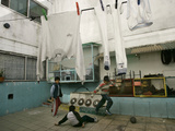 Children of an Immigrant Family from Bolivia Play Soccer at Their House Lámina fotográfica