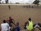 Members of the Royal Football Team Play Soccer as Children Look Photographic Print