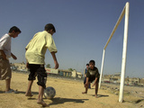 Iraqi Boys Play Soccer in a Baghdad Neighborhood Photographie