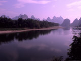 Wonderful Ragged Limestone Mountains at Pink Sunset on the Li River, China Photographie par Bill Bachmann