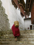 Monk Carrying Basket in Trongsa Dzong, Bhutan Photographic Print by Keren Su