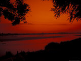 Sunset on Mekong River and Boats, Laos Photographie par Bill Bachmann