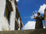 Tibetan Pilgrim with Praying Wheel at Sera Temple, Lhasa, Tibet, China Photographic Print by Keren Su