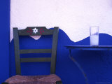 A glass of ouzo on a Taverna table. South Crete. Greece. Photographic Print by Steve Outram