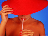 Woman Wearing Red Hat Sipping From a Straw Photographie par Bill Bachmann
