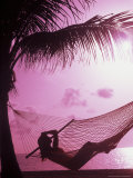 Woman Relaxing in a Hammock on the Beach at Sunset Fotografie-Druck von Bill Bachmann