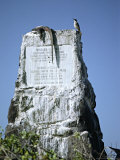 Marine Iguana and Galapagos Mockingbird Atop a Monument, Galapagos Islands, Ecuador Photographic Print by Charles Sleicher