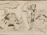Close-up of Figures Carved into a Stone Wall Photographic Print