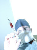 Doctor Holding Hypodermic Needle Containing Red Fluid Photographic Print