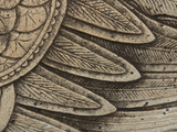 Close-up of Weathered Stone Carved with Feathers Photographic Print