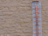 Detail of Thermometer on Stucco Wall Lámina fotográfica