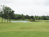 A Golf Course with a Pond Photographic Print