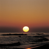 Yellow Sun in Sunset Over Ocean Waves Photographic Print