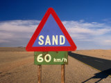 Warning Sign on Road Through Desert Namib Desert Park, Hardap, Namibia Photographic Print by John Borthwick