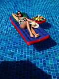 Woman Floating In Pool At Calinda Quality Hotel, Morelia, Michoacan De Ocampo, Mexico Lámina fotográfica por John Neubauer