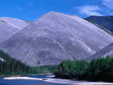 River Flanked by Spruce Trees and Bare Hills, Near Eagle Plains Ogilvie River, Yukon, Canada Photographic Print by Barnett Ross