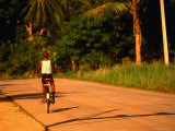 Boy Riding Bike on Dirt Road, Ko Samui, Surat Thani, Thailand Photographic Print by Dallas Stribley