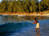 Boy Fishing off Beach, Tofo, Mozambique Photographic Print by Pershouse Craig