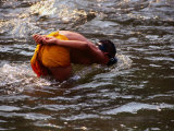 Novice Monk in River, Xieng Kok, Luang Nam Tha, Laos Photographie par Anders Blomqvist