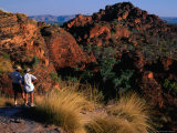 Couple Looking at Hamersley Ranges at Sunset, Karijini National Park, Australia Photographic Print by Trevor Creighton