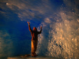 Man Inside Ice Cave of Rhone Glacier, Uri, Switzerland Photographie par Gareth McCormack
