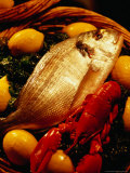 Fish and Lobster on Bed of Green Vegetables and Lemons, Marseille, France Photographic Print by Jean-Bernard Carillet