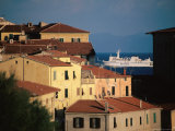 Elba Ferry Passing Old Section of Town, Piombino, Italy Photographic Print by Damien Simonis