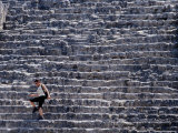 Woman Walking Down Steep Stairs of the Pyramid in El Mundo Perdido Complex, Tikal, Guatemala Photographie par Ryan Fox