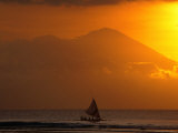 Boat Sailing Past Mt. Agung Across Lombok Strait Gunung Agung, Bali, Indonesia Photographic Print by John Borthwick