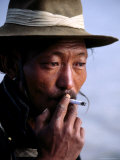 Portrait of Man Smoking, China Photographie par Frank Carter