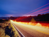 Vehicle Lights and Lightning Illuminating Road, Arches National Park, Utah, USA Photographic Print by Gareth McCormack