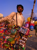 Toy Vendor and Merchandise on Chowpetty Beach, Mumbai, Maharashtra, India Photographic Print by Dallas Stribley