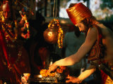 Sadhu Making Puja at Maha Devi Shrine Brings Offerings During Kumbh Mela, Haridwar, India Photographic Print by Paul Beinssen
