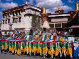 Woman Selling Colourful Prayer Flags in Barkhor Square, in Front of Jokhang Temple, Lhasa, China Photographic Print by Pershouse Craig