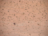 Two Distant People Walking Desert of Wadi Rum, Wadi Rum National Reserve, Aqaba, Jordan Photographic Print by Jane Sweeney